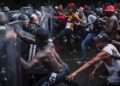 Se enfrentan caravana migrante y la Guardia Nacional