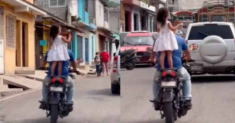 Indigna imprudencia de papá al llevar a niña parada y sin protección sobre la moto